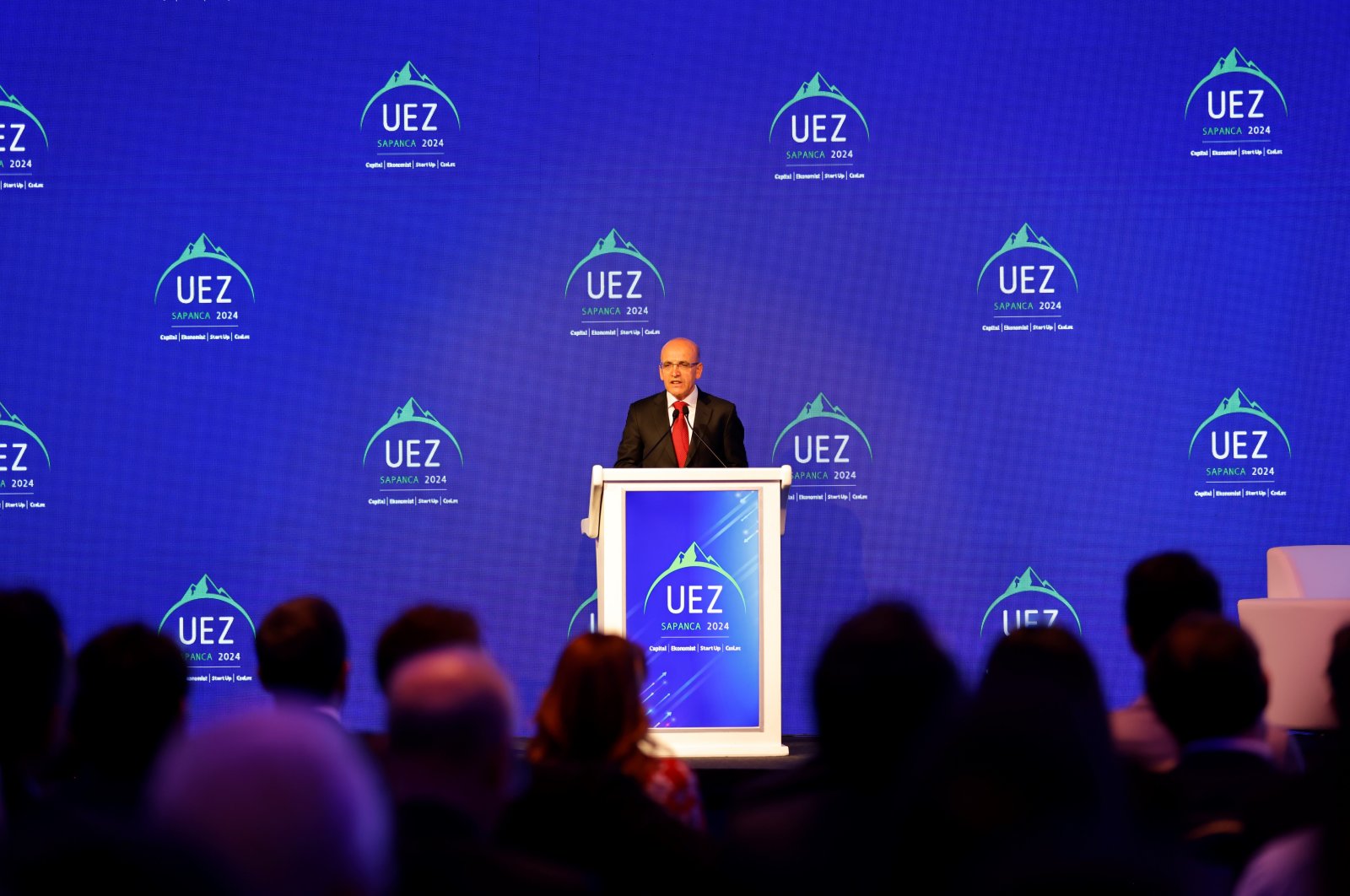 Treasury and Finance Minister Mehmet Şimşek speaks during the Uludağ Economic Summit in Sapanca, Sakarya province, northwestern Türkiye, April 26, 2024. (IHA Photo) 