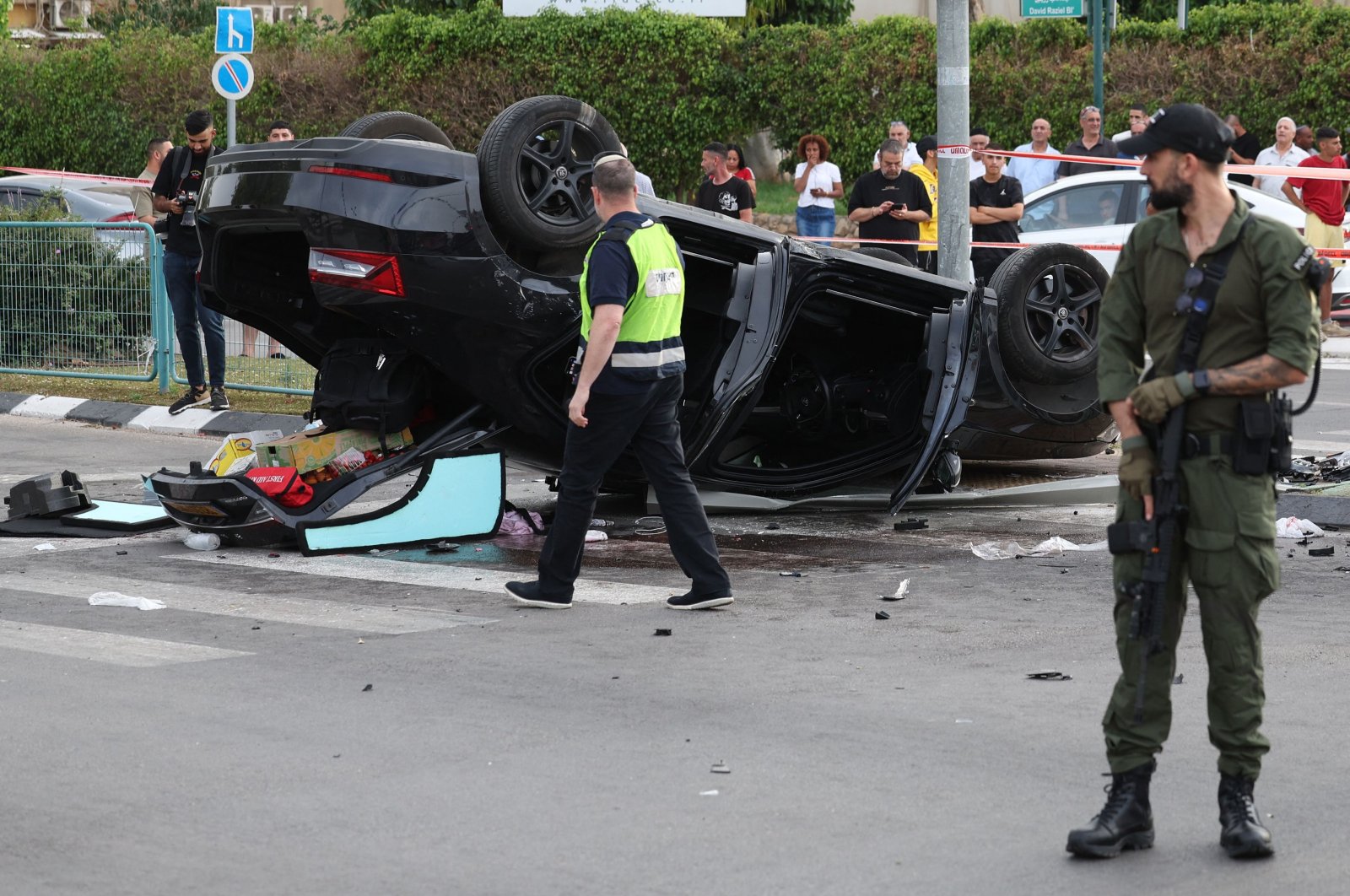 Israeli police cordon off the site of a car accident, where Israeli minister Itamar Ben-Gvir was lightly hurt after his car was involved in an accident, in Ramla south of Tel Aviv, on April 26, 2024. (AFP Photo)