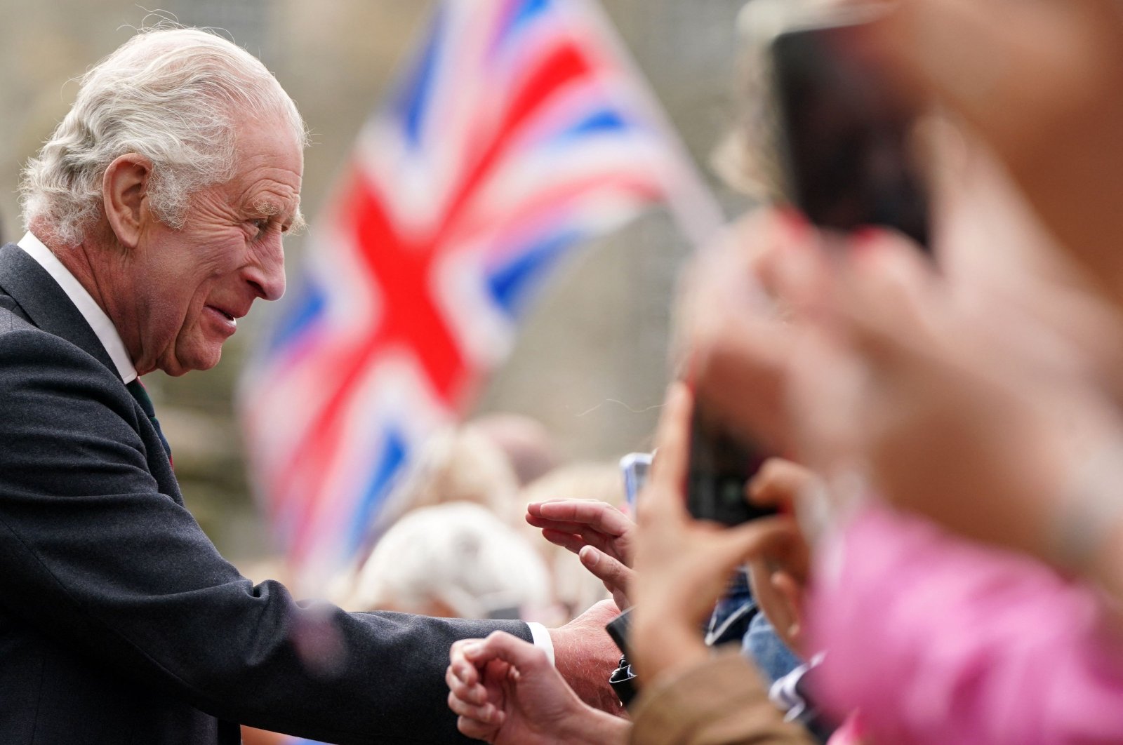 Britain&#039;s King Charles III  meets members of the public, some waving Union flags, during a visit Kinneil House in Edinburgh, Scotland on July 3, 2023. (AFP File Photo)