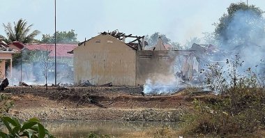 Smoke billows from the warehouse following an explosion at an army base in Kampong Speu province, Cambodia, April 27, 2024. (AFP Photo)