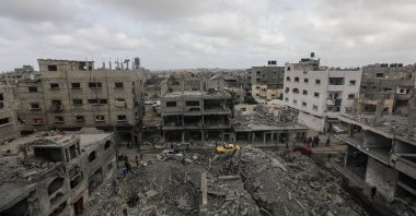 Palestinians search for bodies and survivors in the rubble of a house destroyed by an Israeli air strike in Al Nusairat refugee camp, southern Gaza Strip, Palestine, April 27, 2024. (EPA Photo)