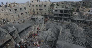 Palestinians search for bodies and survivors in the rubble of a house destroyed by an Israeli airstrike in Al Nusairat refugee camp, southern Gaza, Palestine, April 27, 2024. (EPA Photo)