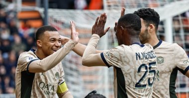 Kylian Mbappe (L) celebrates with teammates after scoring the 0-2 goal during the French Ligue 1 match against FC Lorient, Lorient, France, April 24, 2024. (EPA Photo)