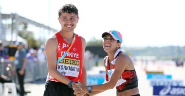 Turkish athletes Salih Korkmaz (L) and Meryem Bekmez celebrate after securing the 2024 Paris Olympics, Antalya, Türkiye, April 21, 2024. (IHA Photo)
