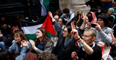 Students hold Palestinian flags as they block the entrance of the Sorbonne University in support of Palestinians in Gaza, Paris, France, April 29, 2024. (Reuters Photo)