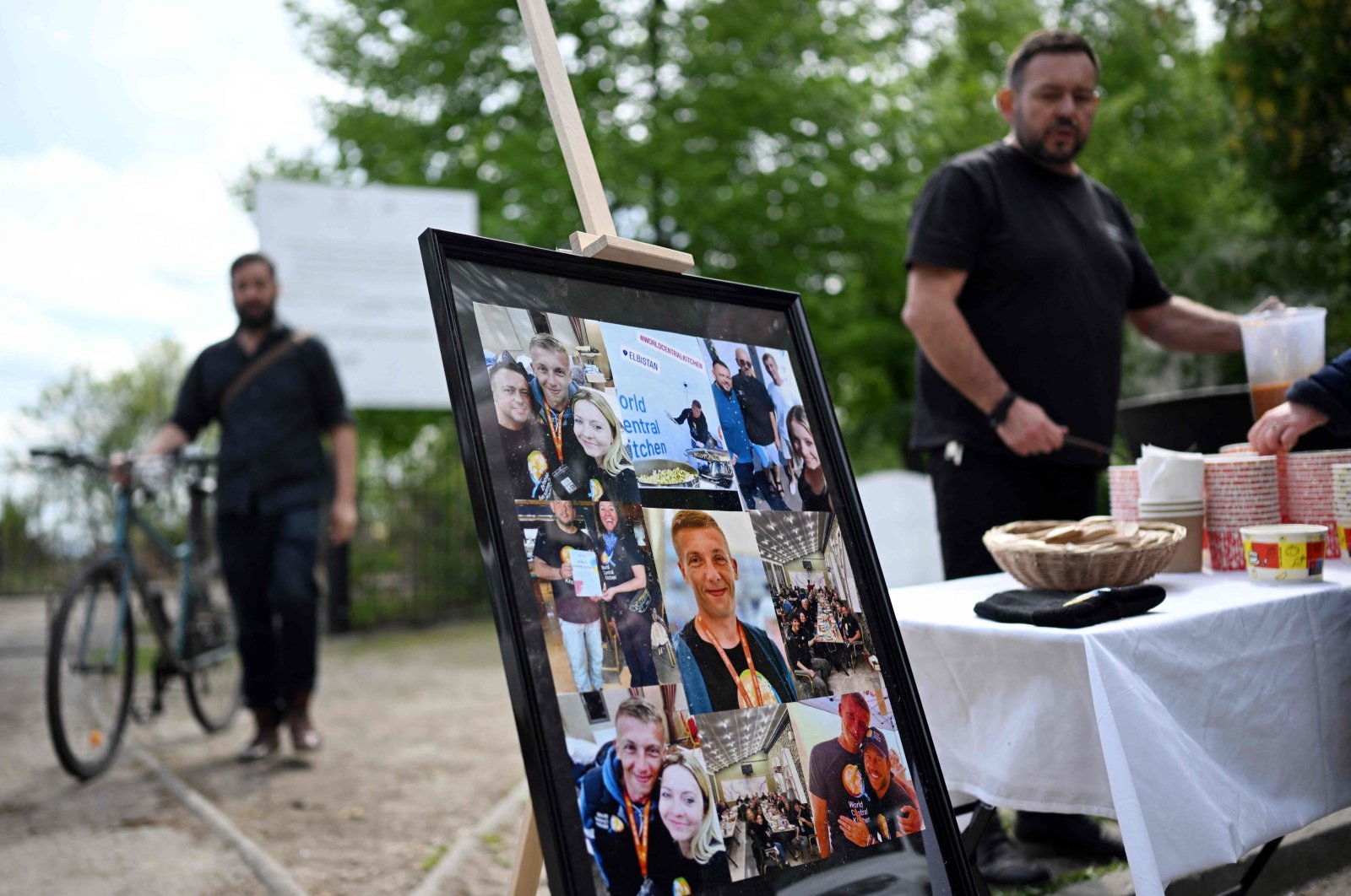 A set of photographs of Damian Sobol, a member of the U.S.-based food charity World Central Kitchen, killed in an Israeli strike in Gaza, is seen during his funeral ceremony at the cemetery in his hometown of Przemysl, Poland, April 20, 2024. (AFP Photo)