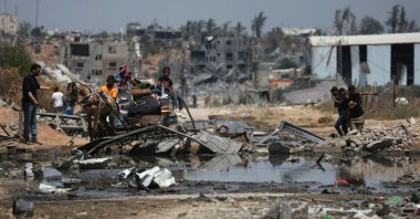Palestinians ride an animal-pulled cart in Nuseirat amid Israel's ongoing genocidal attacks, in the central Gaza Strip, Palestine, April 29, 2024. (AFP Photo)