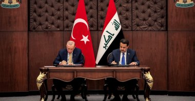 President Recep Tayyip Erdoğan (L) and Iraq's Prime Minister Mohammed S. Al Sudani sign mutual agreements during their meeting, Baghdad, Iraq, April 22, 2024. (Reuters Photo)