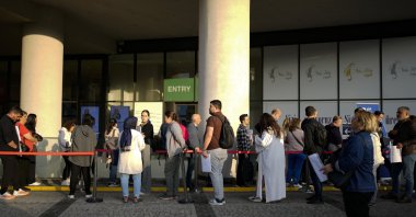People wait for their turn at a visa application center in Istanbul, Nov. 3, 2023. (AP Photo)