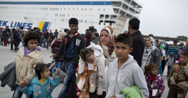 People arrive on a ferry from the northeastern Greek island of Chios at the Athens port of Piraeus, Wednesday, Oct. 21, 2015. (AP File Photo)