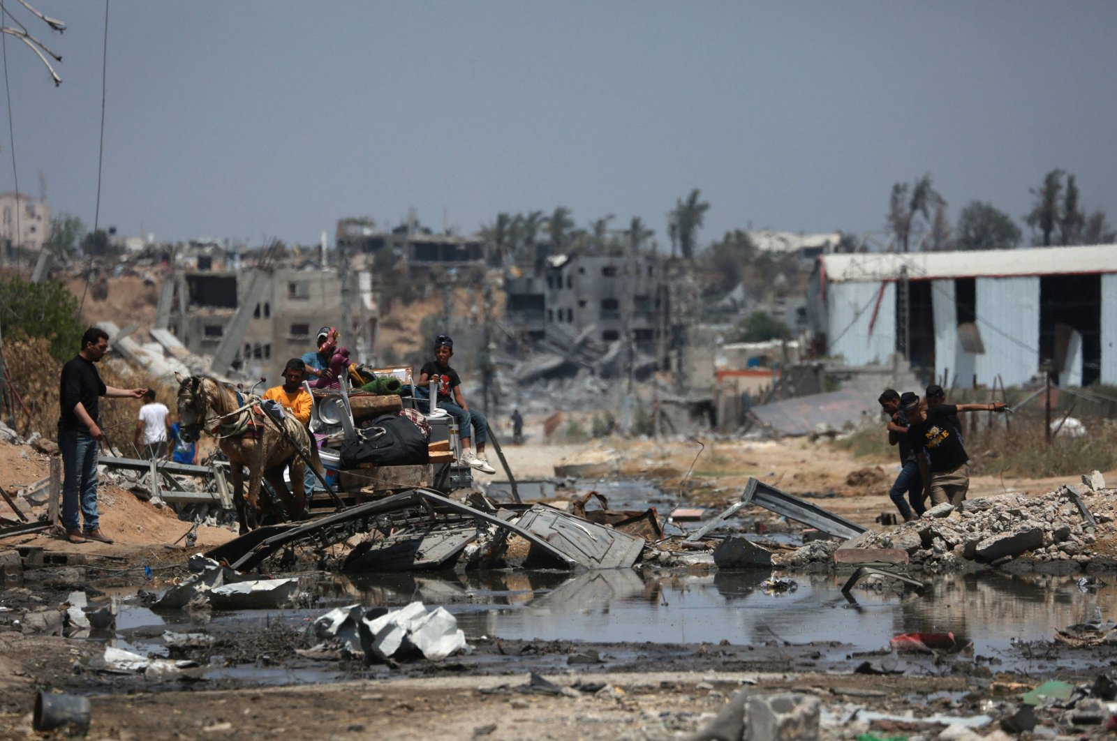 Palestinians ride an animal-pulled cart in Nuseirat amid Israel&#039;s ongoing genocidal attacks, in the central Gaza Strip, Palestine, April 29, 2024. (AFP Photo)