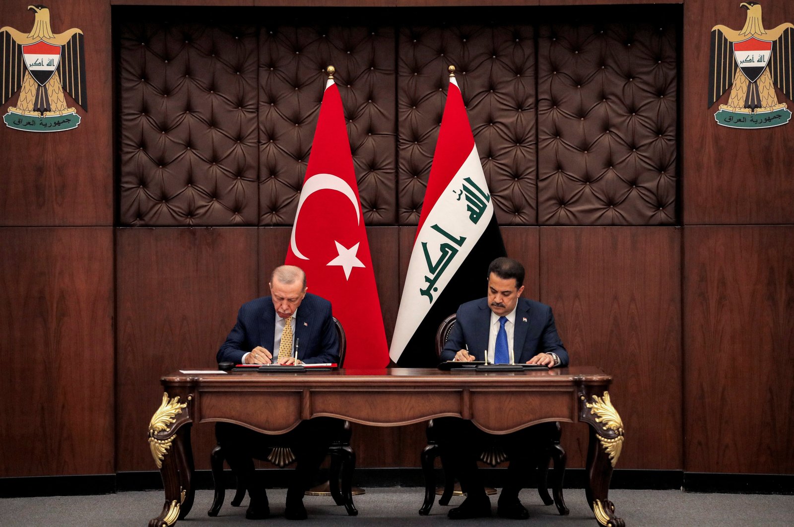 President Recep Tayyip Erdoğan (L) and Iraq&#039;s Prime Minister Mohammed S. Al Sudani sign mutual agreements during their meeting, Baghdad, Iraq, April 22, 2024. (Reuters Photo)