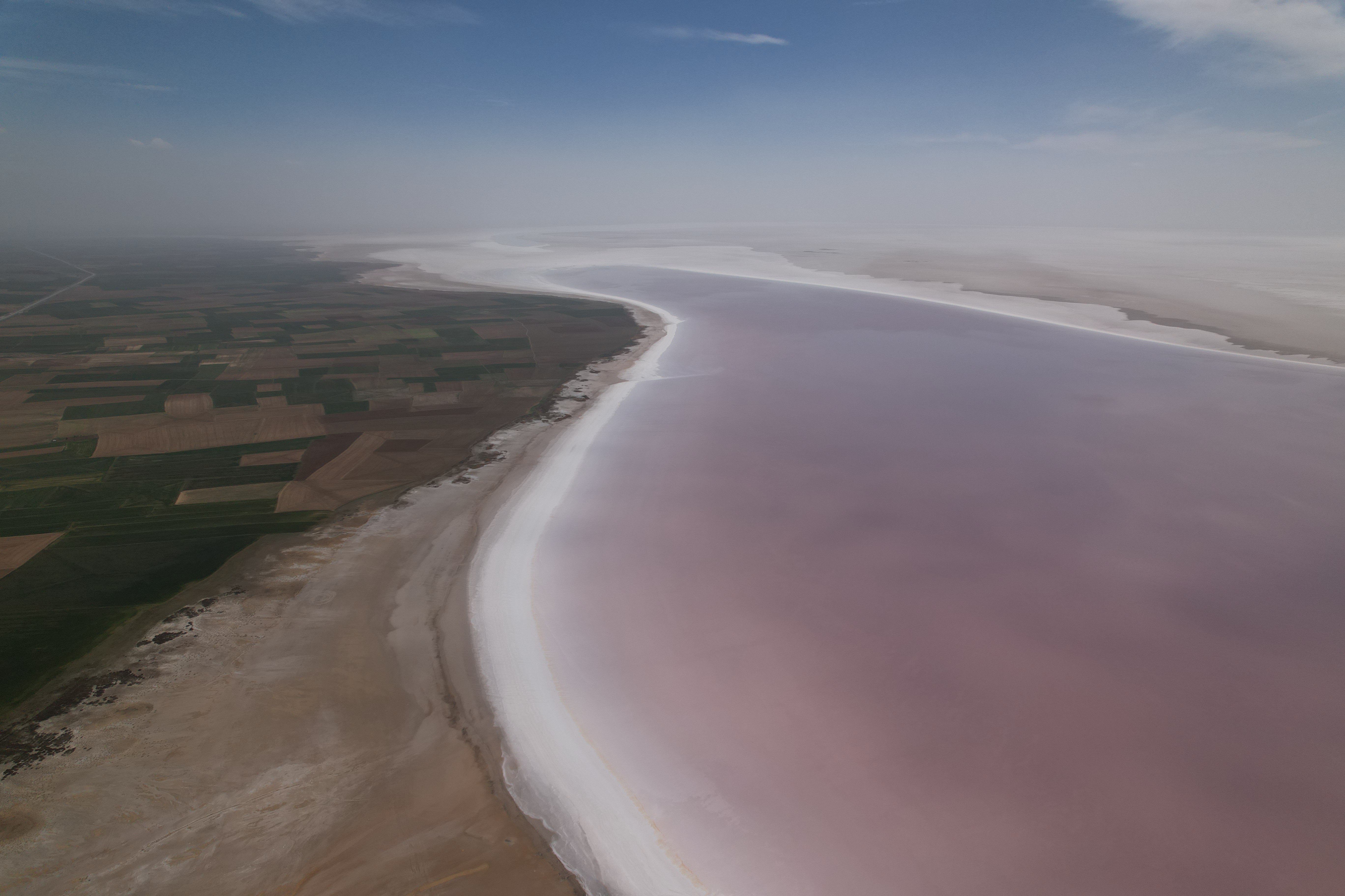 Tuz Lake turns pink due to algae, drawing tourists&#039; attention, Tuz Lake, central Türkiye. April 21, 2024. (IHA Photo)