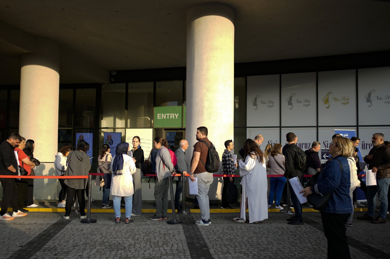 People wait for their turn at a visa application center in Istanbul, Nov. 3, 2023. (AP Photo)
