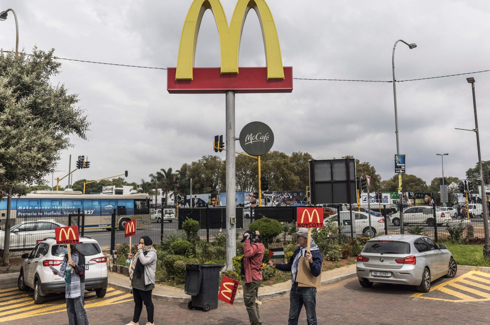 Demonstrators carry placards calling for the boycott of the fast food chain McDonald’s, accused of giving free meals to Israeli soldiers operating in and around the Gaza Strip, outside a franchise in Johannesburg, South Africa, April 15, 2024. (AFP Photo)