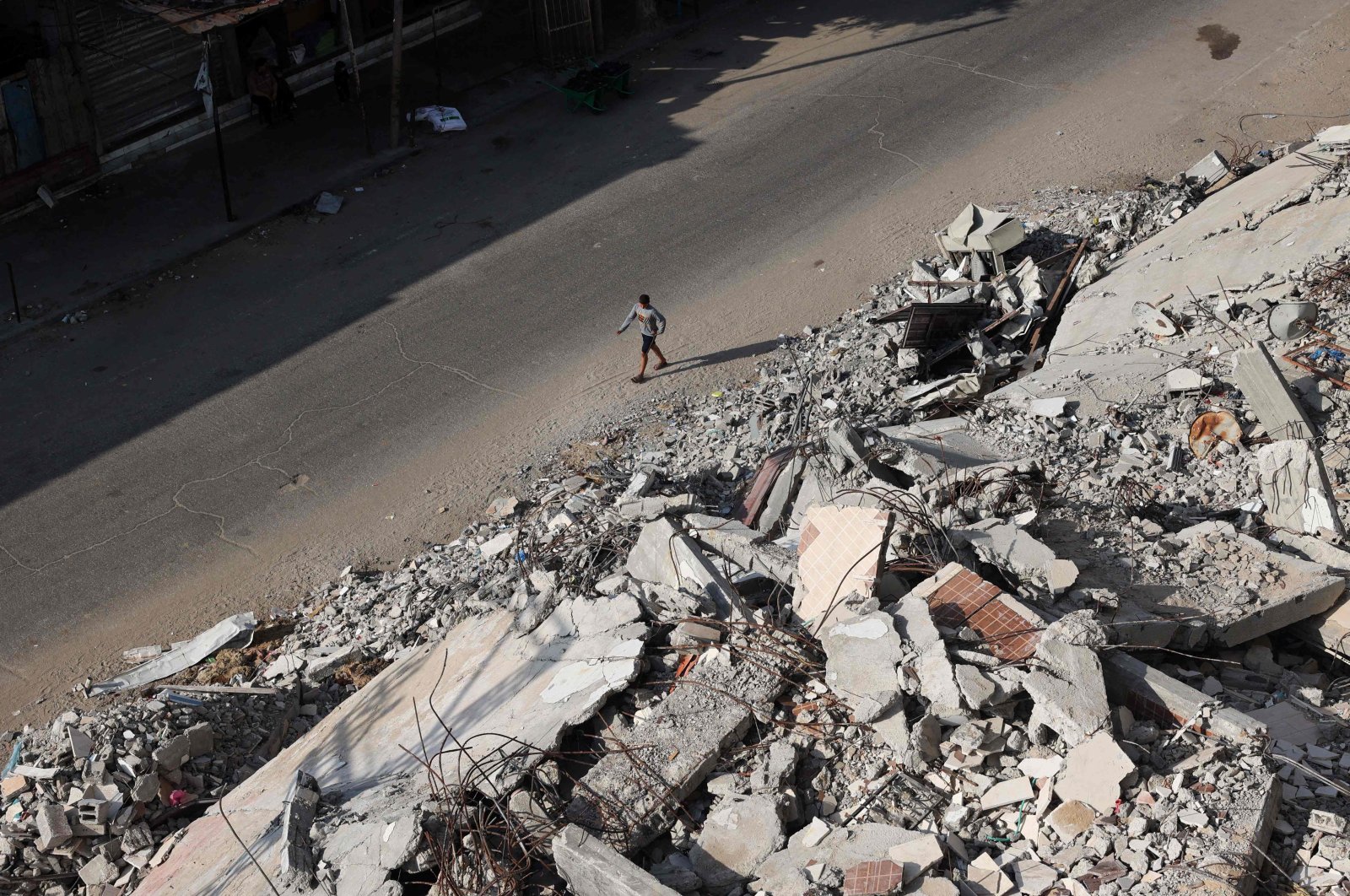 A Palestinian walks past the rubble of buildings destroyed in Israeli bombardments, in Rafah, in the southern Gaza Strip, Palestine, April 30, 2024. (AFP Photo)