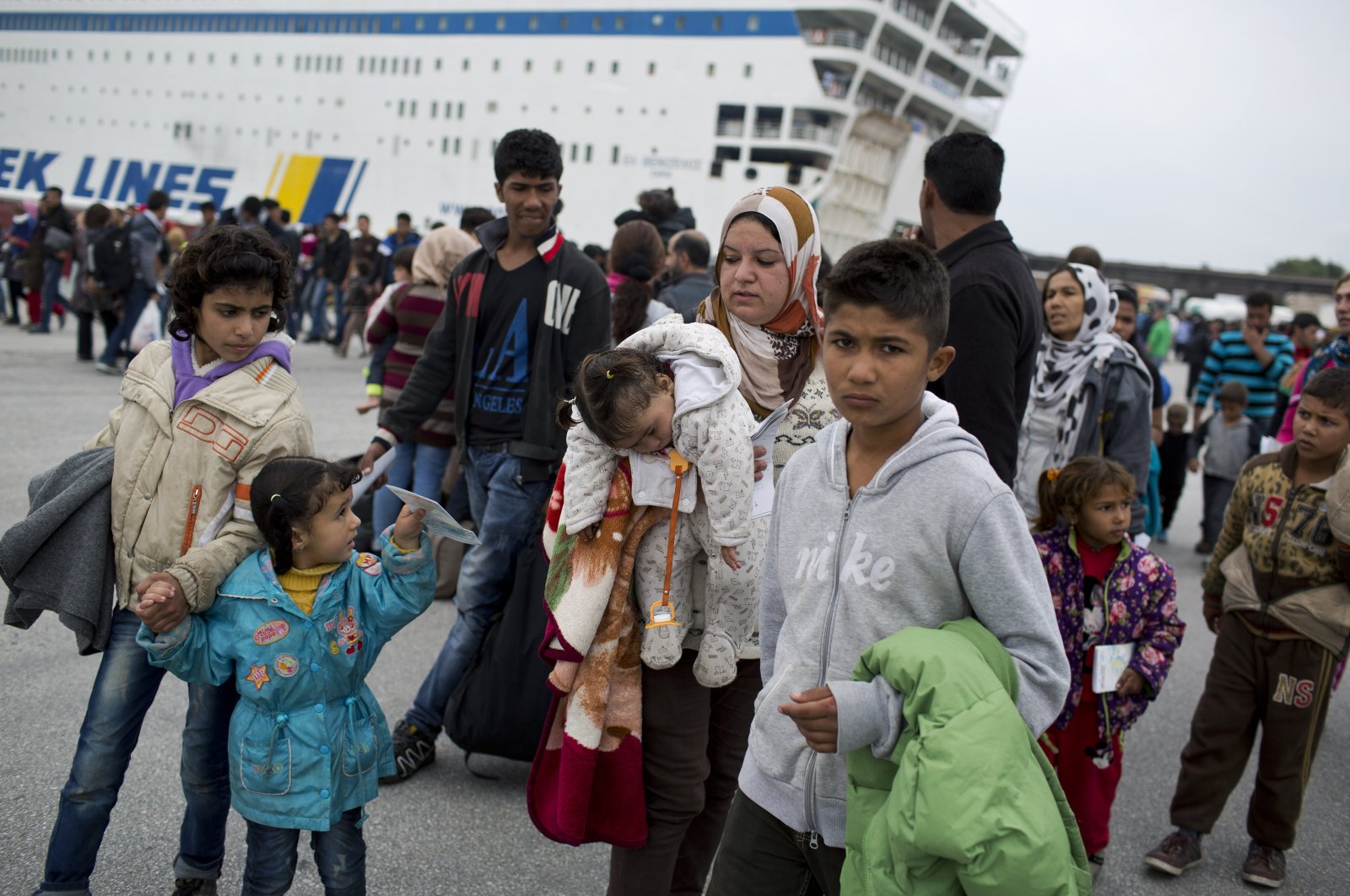 People arrive on a ferry from the northeastern Greek island of Chios at the Athens port of Piraeus, Wednesday, Oct. 21, 2015. (AP File Photo)