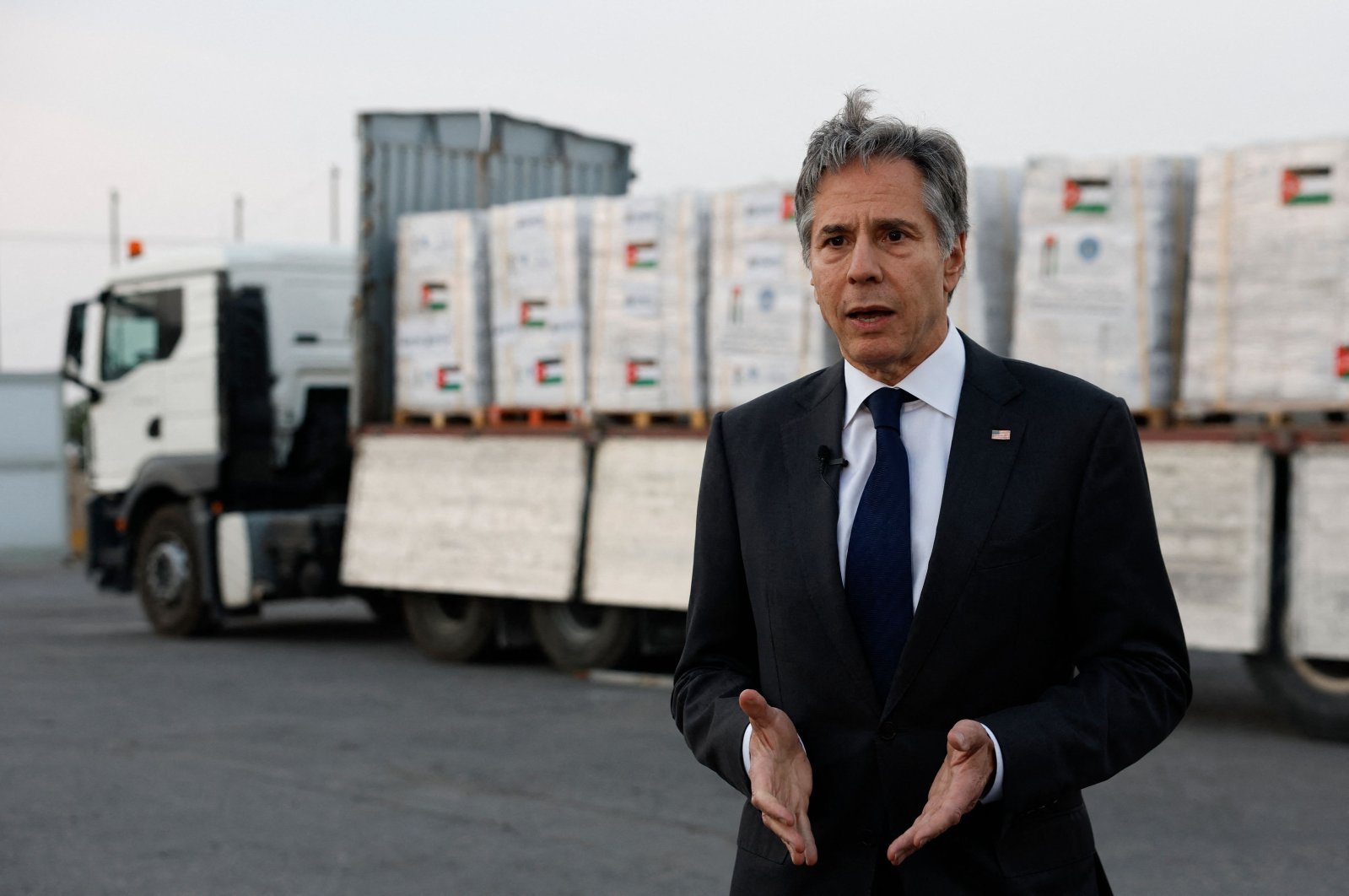 U.S. Secretary of State Antony Blinken speaks to the press in front of a truck with humanitarian aid bound for Gaza at the Jordanian Hashemite Charity Organization (JHCO) premises in Amman on April 30, 2024. (AFP Photo)