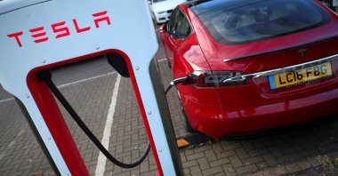 A Tesla car is charged at a Tesla dealership in West Drayton, just outside London, Britain, Feb. 7, 2018. (Reuters Photo)