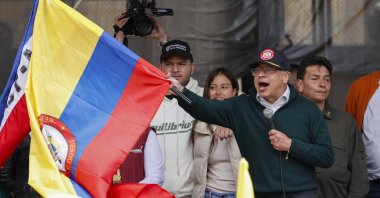Colombia's President Gustavo Petro waves a Colombian national flag in the middle of his speech at the end of a demonstration to mark International Workers' Day at Bolivar square in Bogota, Colombia, May 1, 2024. (EPA Photo)