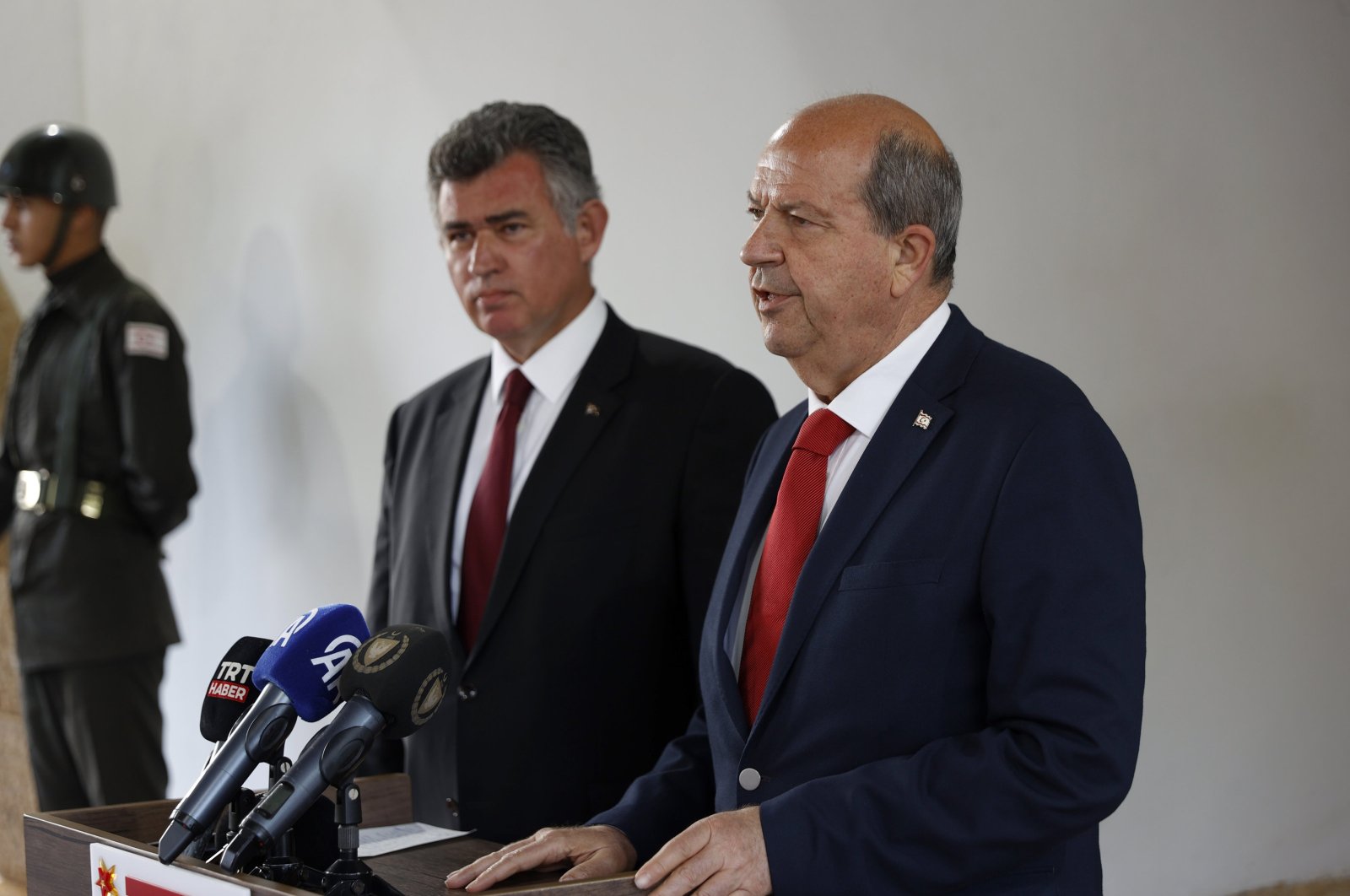 Turkish Republic of Northern Cyprus (TRNC) President Ersin Tatar (R) stands next to Turkish Ambassador Metin Feyzioğlu as he speaks at an event at the presidential building, Lefkoşa (Nicosia), TRNC, April 14, 2024. (AA Photo)