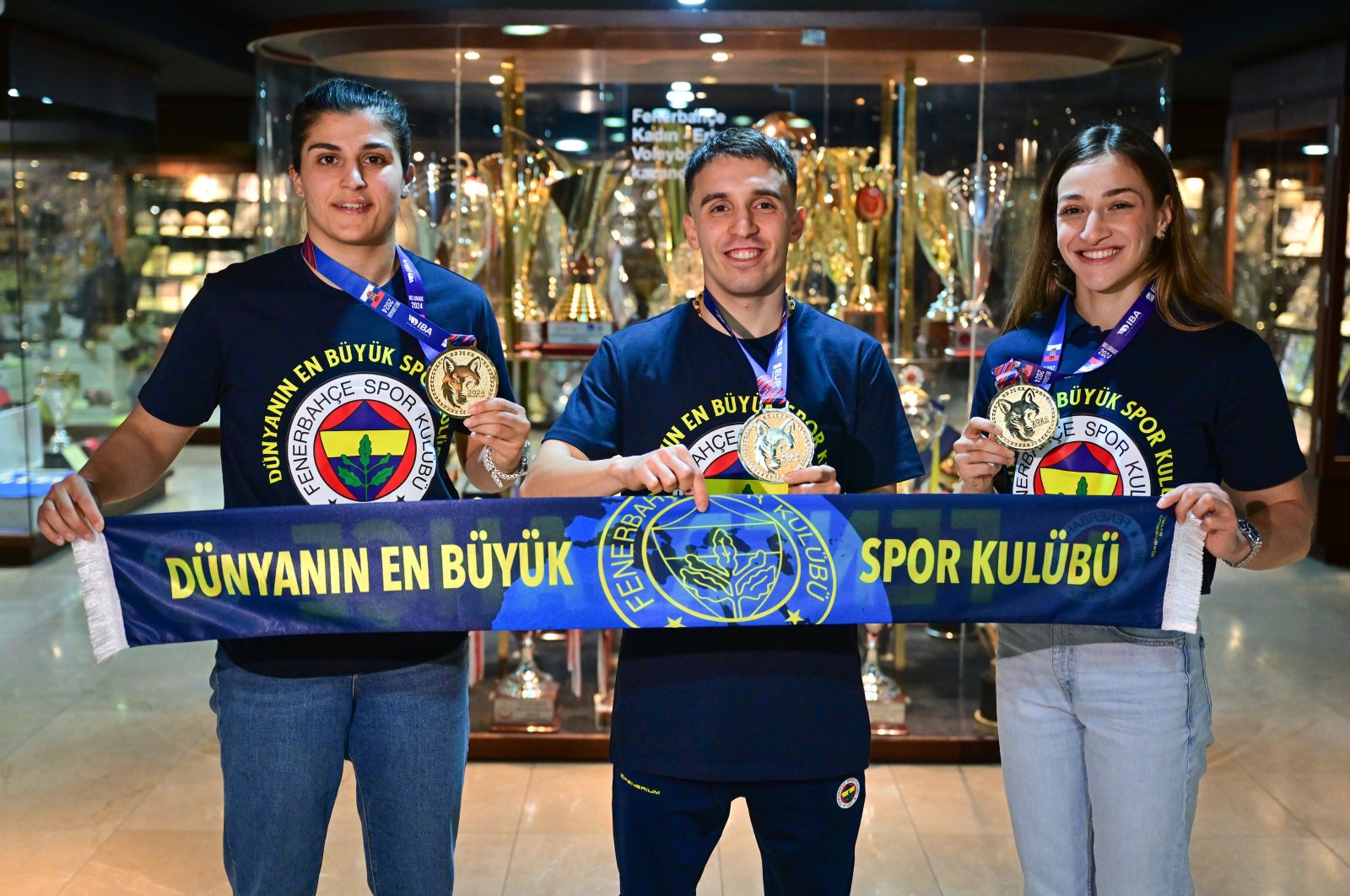 (L-R) Fenerbahçe&#039;s European champion national boxers Busenaz Sürmeneli, Samet Gümüş and Buse Naz Çakıroğlu pose with their 2024 European Boxing Championship medals at the Fenerbahçe museum, Istanbul, Türkiye, April 30, 2024. (AA Photo)