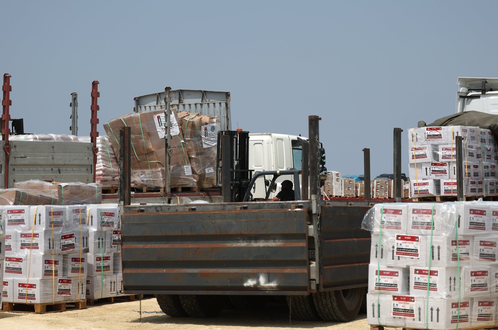 Trucks carrying humanitarian aid to the northern part of the Gaza Strip are checked on the Palestinian side of the Erez Crossing, in Beit Hanoun town, at the border between Israel and northern Gaza, May 1, 2024. (EPA Photo)