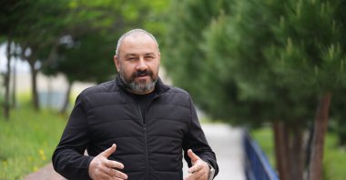 Turkish Triathlon Federation education committee member, professor Dr. Selçuk Bora Çavuşoğlu speaks during an interview with Anadolu Agency (AA), Istanbul, Türkiye, April 29, 2024. (AA Photo)
