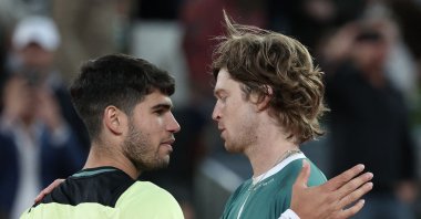 Russia's Andrey Rublev (R) greets Spain's Carlos Alcaraz after winning a 2024 ATP Tour Madrid Open tournament quarterfinals match, Caja Magica, Madrid, Spain, May 1, 2024. (AFP Photo)