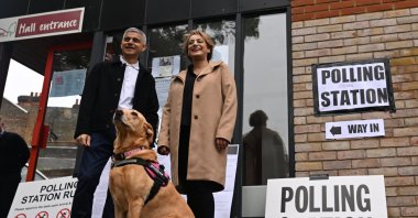 London Mayor Sadiq Khan (L) and his wife Saadiya Khan pose for the media as they arrive at a polling station to vote in local elections in London, the U.K., May 2, 2024.
