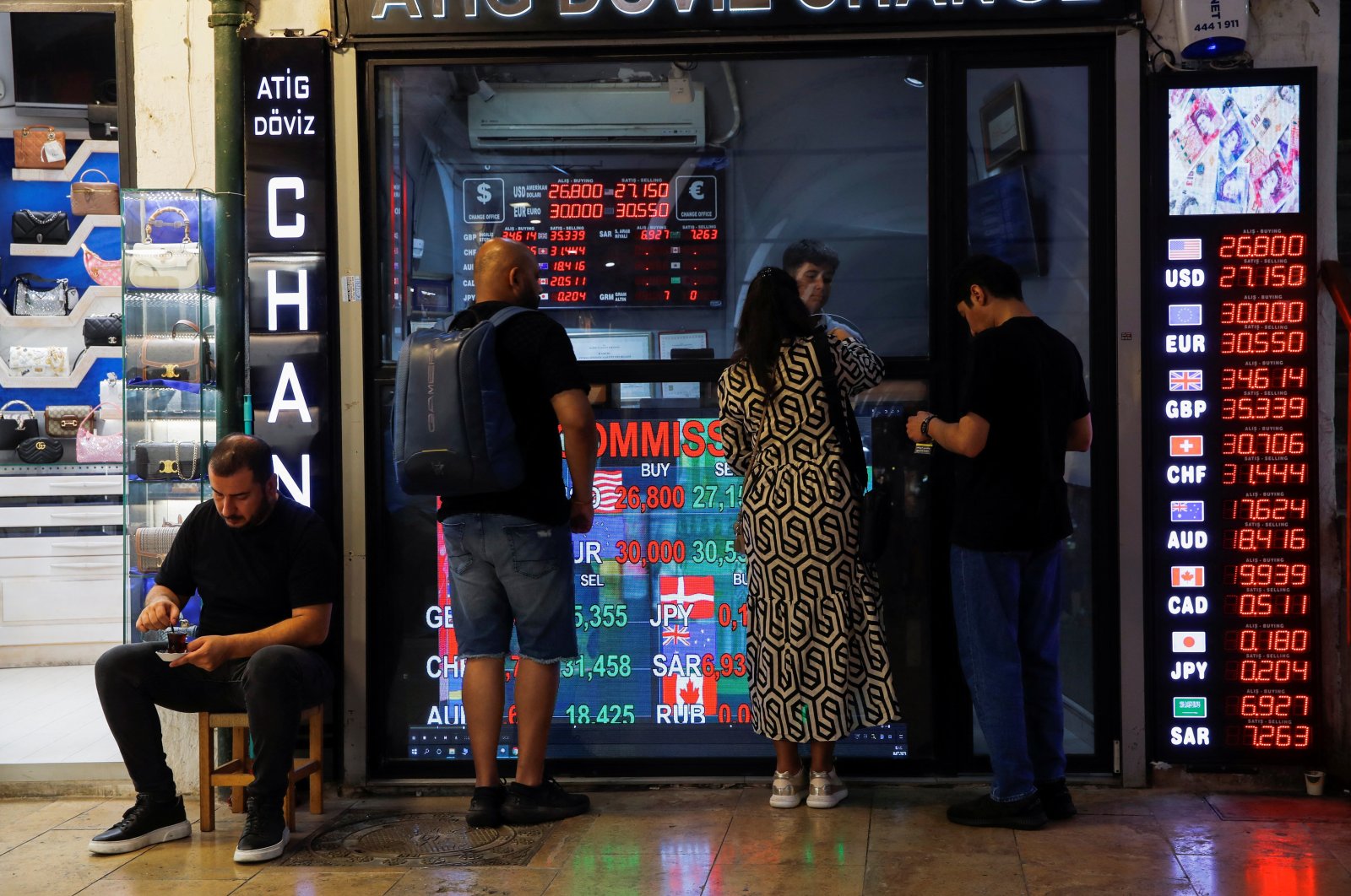 People visit a currency exchange office in Istanbul, Türkiye, July 18, 2023. (Reuters Photo)