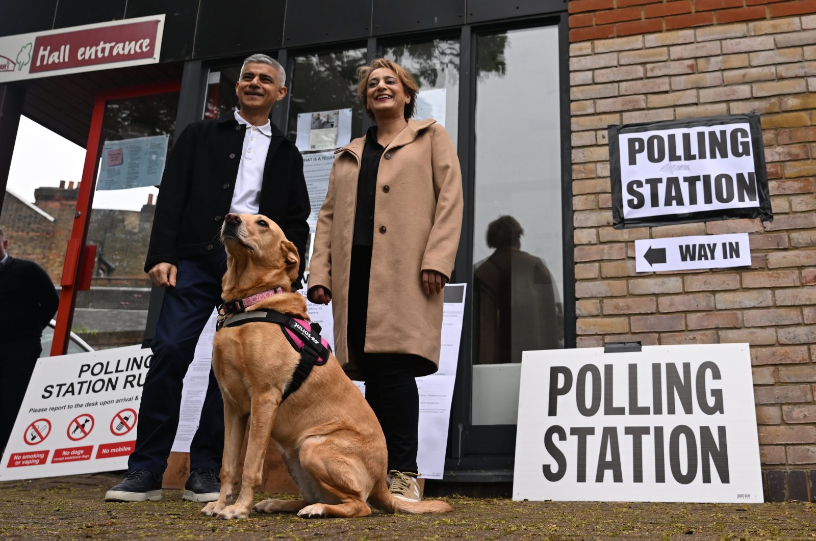 London Mayor Sadiq Khan (L) and his wife Saadiya Khan pose for the media as they arrive at a polling station to vote in local elections in London, the U.K., May 2, 2024.