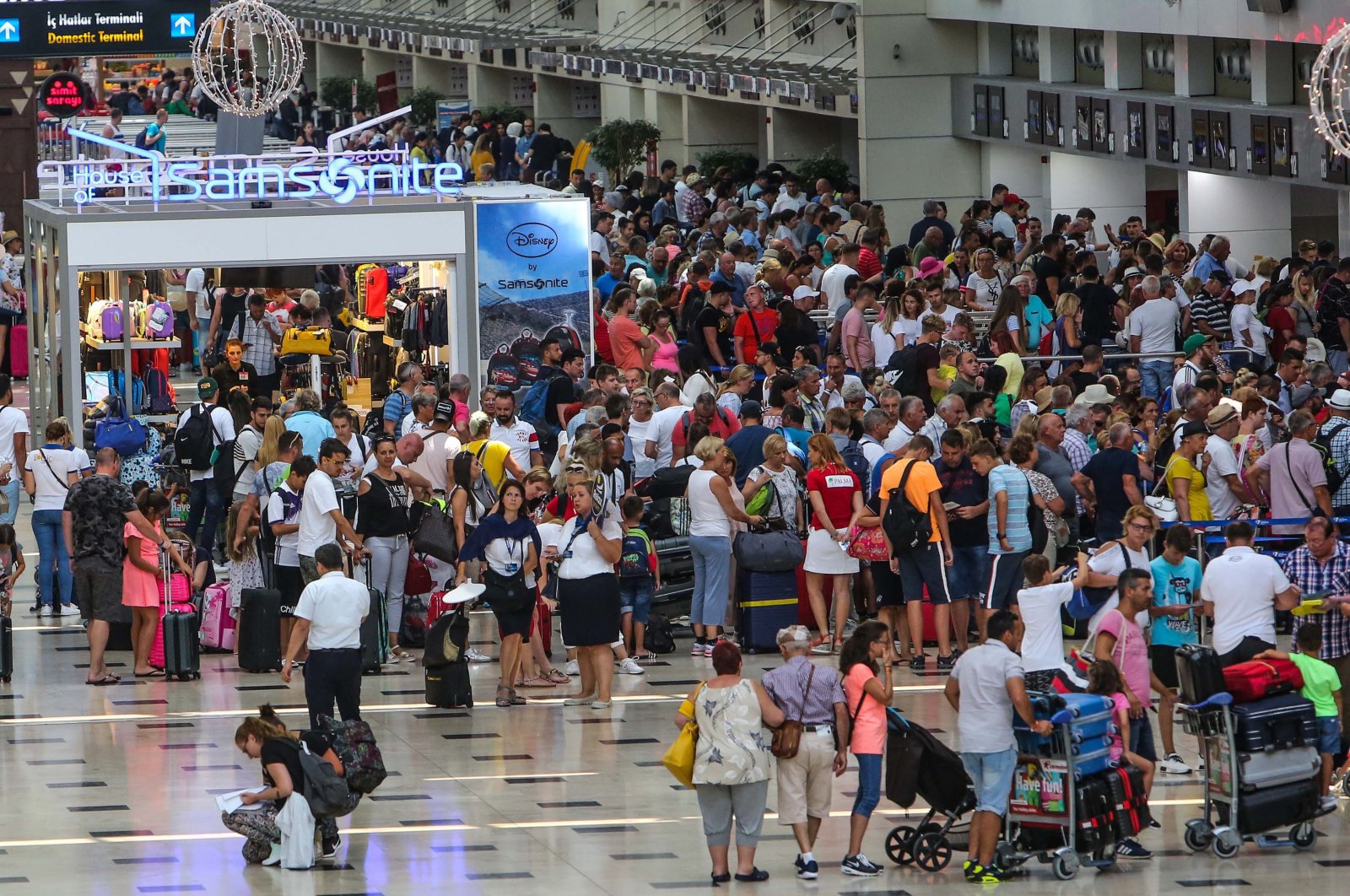 An aerial view of passengers at the terminal of Antalya Airport, Antalya, Türkiye. (DHA Photo)