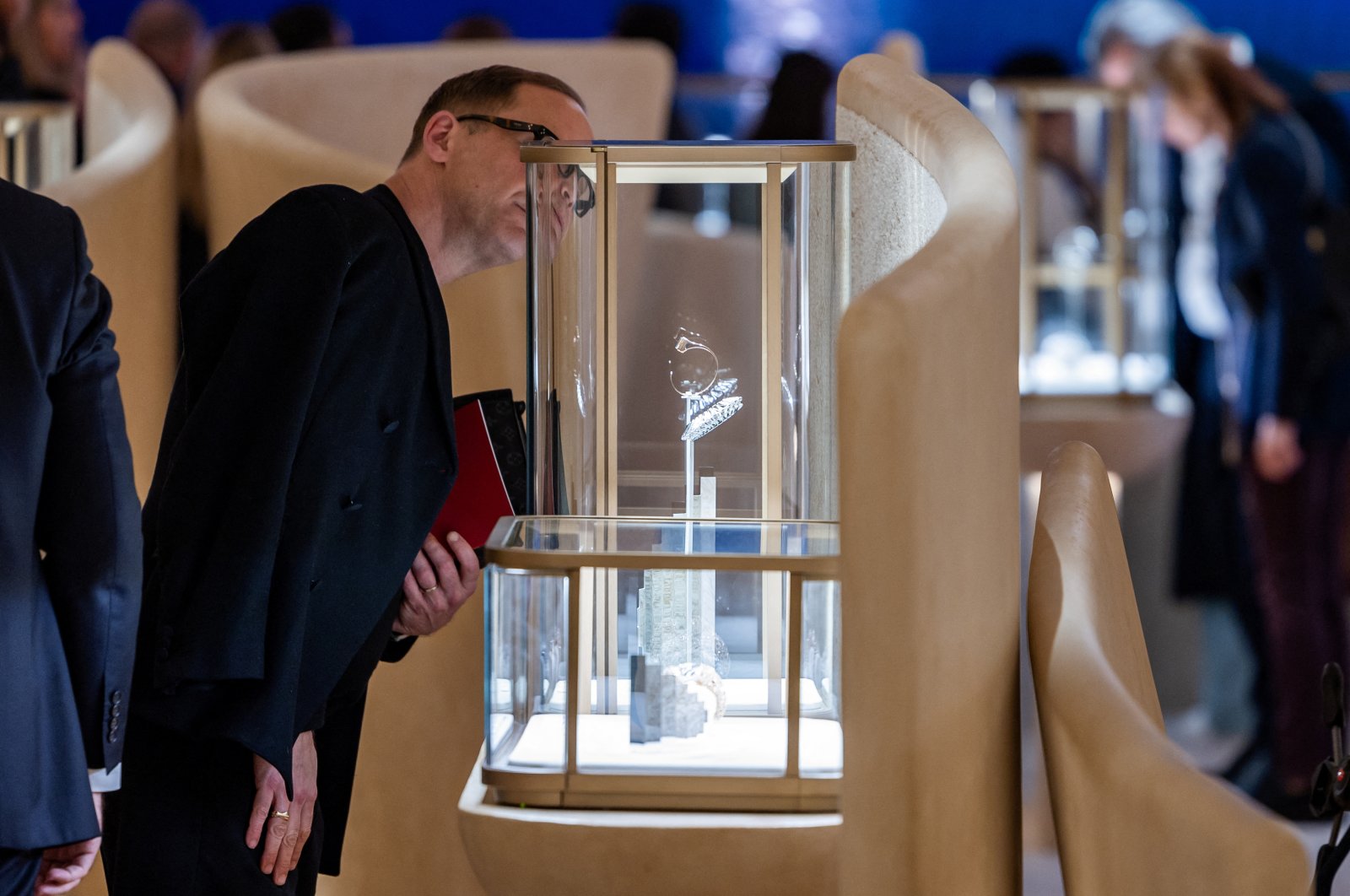 A visitor looks at watch models at the Cartier booth at the Watches and Wonders exhibition in Geneva, Switzerland, April 9, 2024. (Reuters Photo)