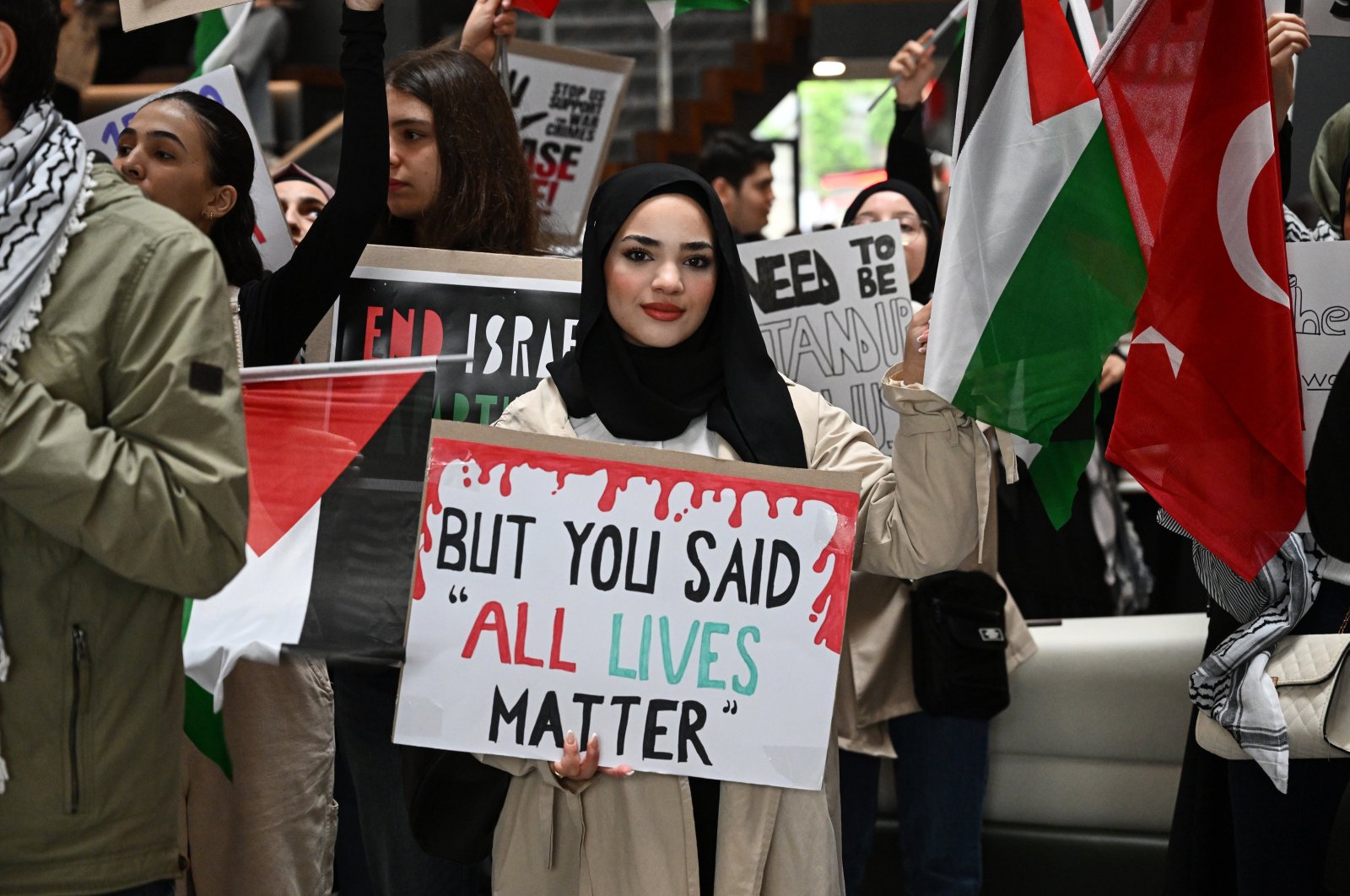 An Istanbul Medipol University student holds a poster that says &quot;But You Said All Lives Matter&quot; at a rally for Palestine and U.S. campus protests, Istanbul, Türkiye, May 2, 2024. (AA Photo)