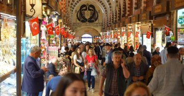 People are photographed at the famous Spice Bazaar in Eminönü neighborhood, Istanbul, Türkiye, April 5, 2024. (IHA Photo)