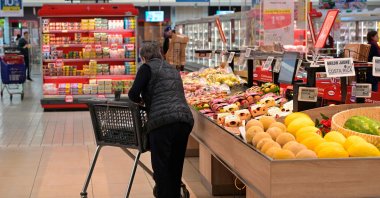 A customer shops at a supermarket in Pace, outside Rennes, France, April 26, 2024. (AFP Photo)