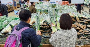 Women shop for green onions at a market in Seoul, South Korea, March 26, 2024. (Reuters Photo)