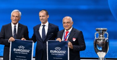 UEFA President Aleksander Ceferin (C) shows the name of Italy and Türkiye elected to host the Euro 2032 football tournament with Gabriele Gravina (L), president of the Italian Football Federation (FIGC) and Mehmet Büyükekşi (R), president of the Turkish Football Federation (TFF), Nyon, Switzerland, Oct. 10, 2023. (EPA Photo)