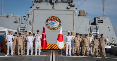 Turkish crew and soldiers from a Japanese base pose aboard TCG Kınalıada, Djibouti, April 20, 2024. (AA Photo)