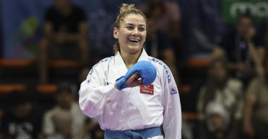 Undated picture shows Turkish karateka Tuğba Yakan celebrating after winning. (DHA Photo)