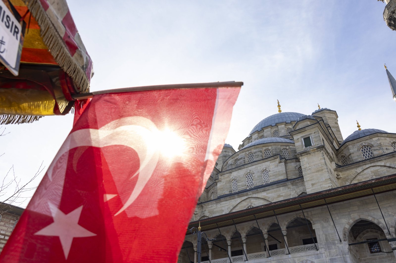 Turkish flag and view of the New Mosque in Istanbul, Türkiye, Feb. 10, 2024. (Reuters Photo)