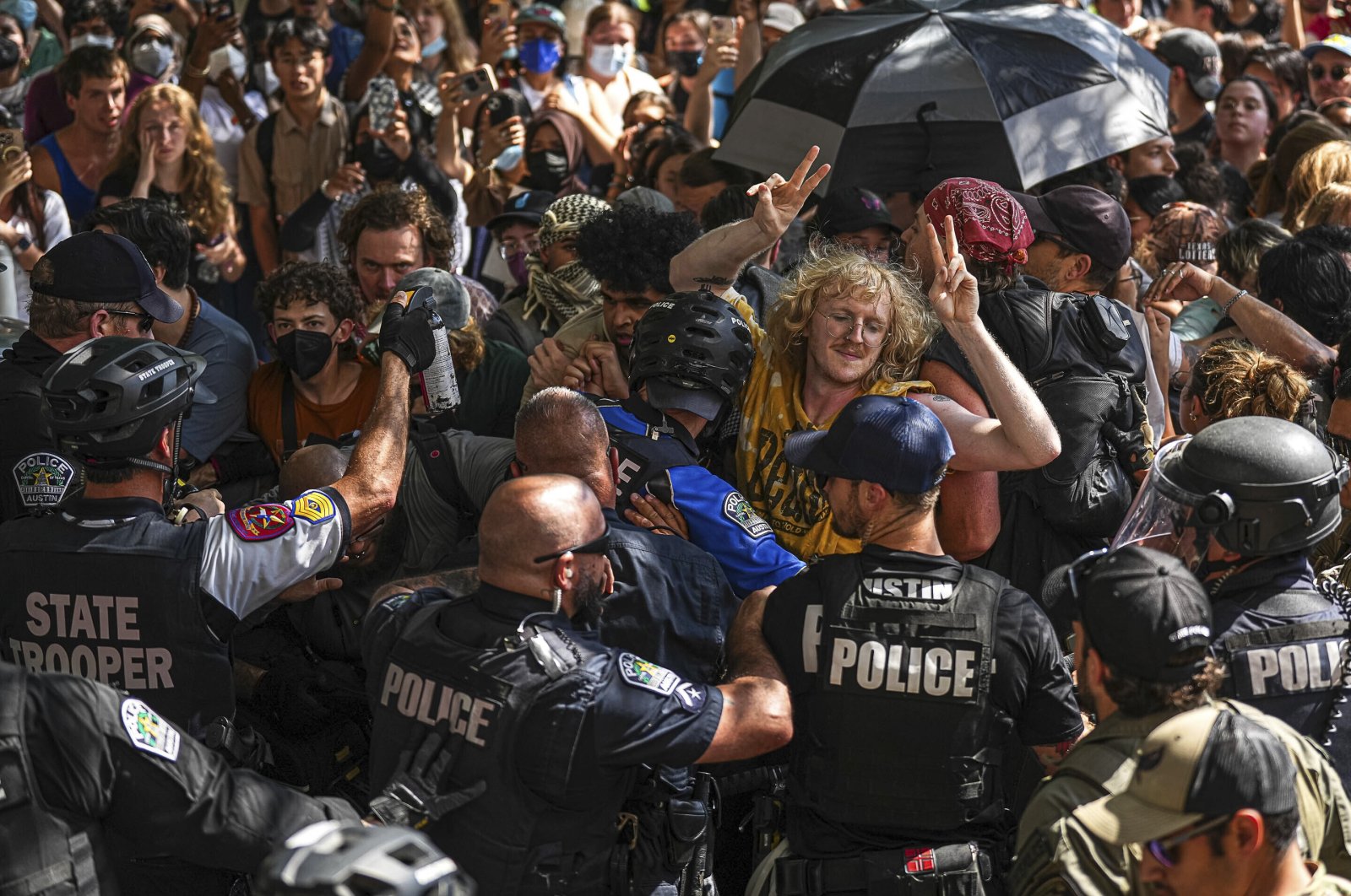 Pro-Palestinian protesters block police vehicles from leaving University of Texas, Austin, Texas, U.S., April 29, 2024. (AP Photo)