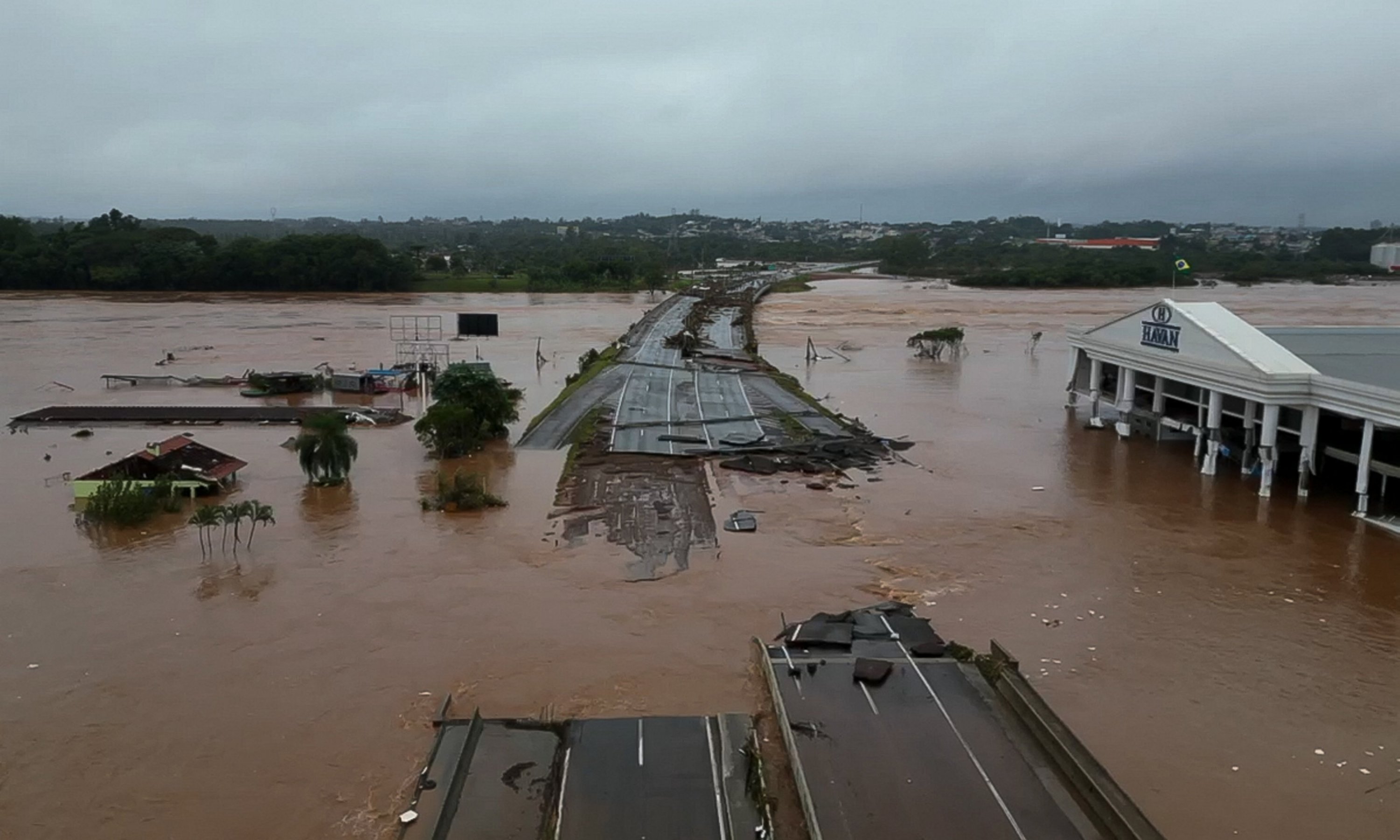 An aerial view of the flooded Taquari bridge, part of the BR-396 highway that connects the cities of Lageado and Estrela, Vale do Taquari, Rio Grande do Sul state, Brazil, May 3, 2024. (AFP Photo)