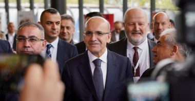 Treasury and Finance Minister Mehmet Şimşek (C) arrives for an event in Düsseldorf, North Rhine-Westphalia, Germany, May 4, 2024. (AA Photo)