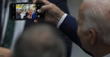 U.S. President Joe Biden takes a selfie after speaking at Ingeteam Inc., Milwaukee, U.S., Aug. 15, 2023. (AP Photo)