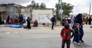 Internally displaced Palestinians, including women and children, carry their belongings on a donkey-drawn cart after an evacuation order issued by the Israeli army, in Rafah, southern Gaza Strip, May 6, 2024. (EPA Photo)