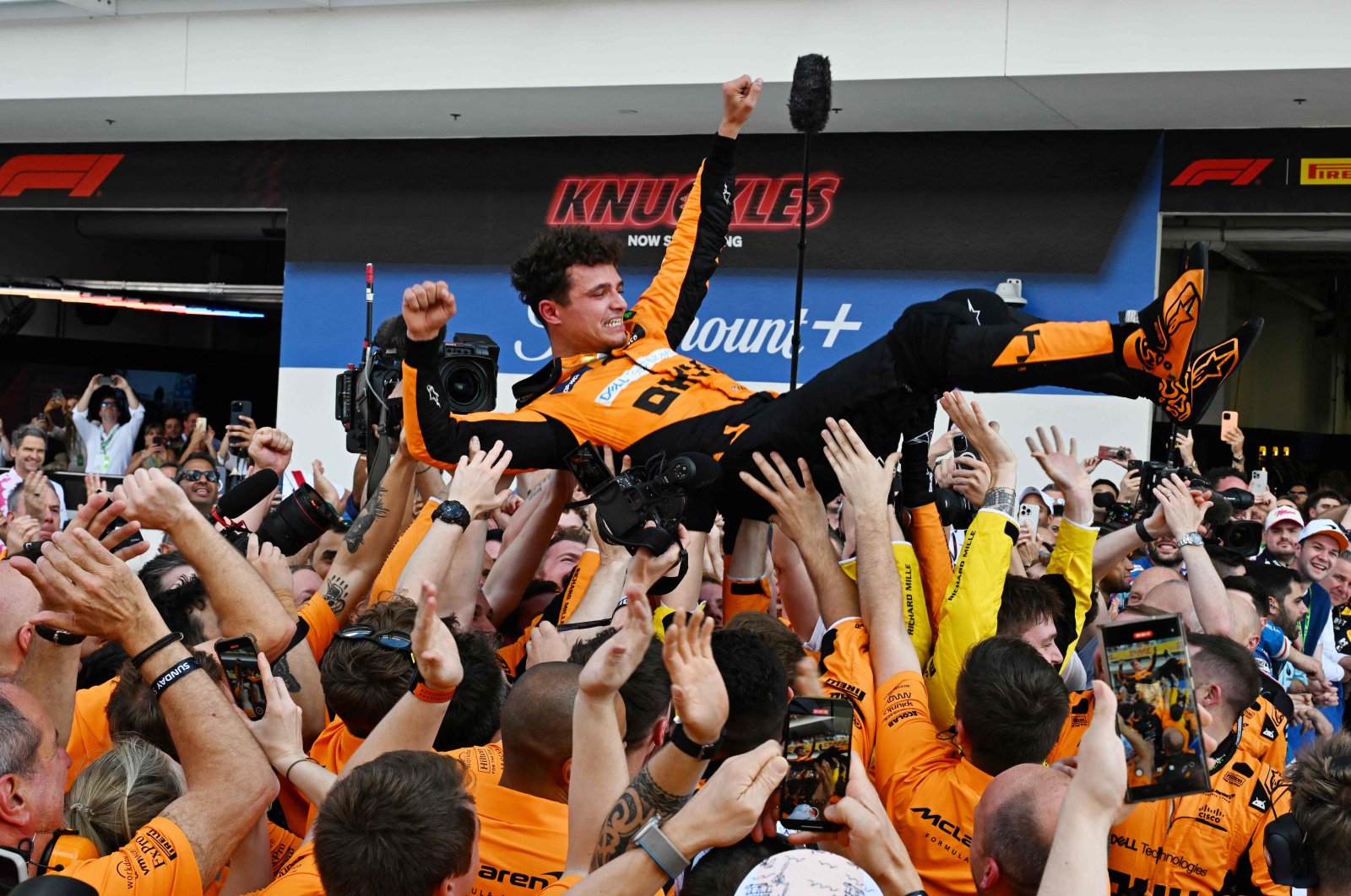 McLaren&#039;s Lando Norris is tossed in the air as his team celebrates his victory in the 2024 Miami Formula One Grand Prix at Miami International Autodrome, Miami Gardens, Florida, U.S., May 5, 2024. (AFP Photo)