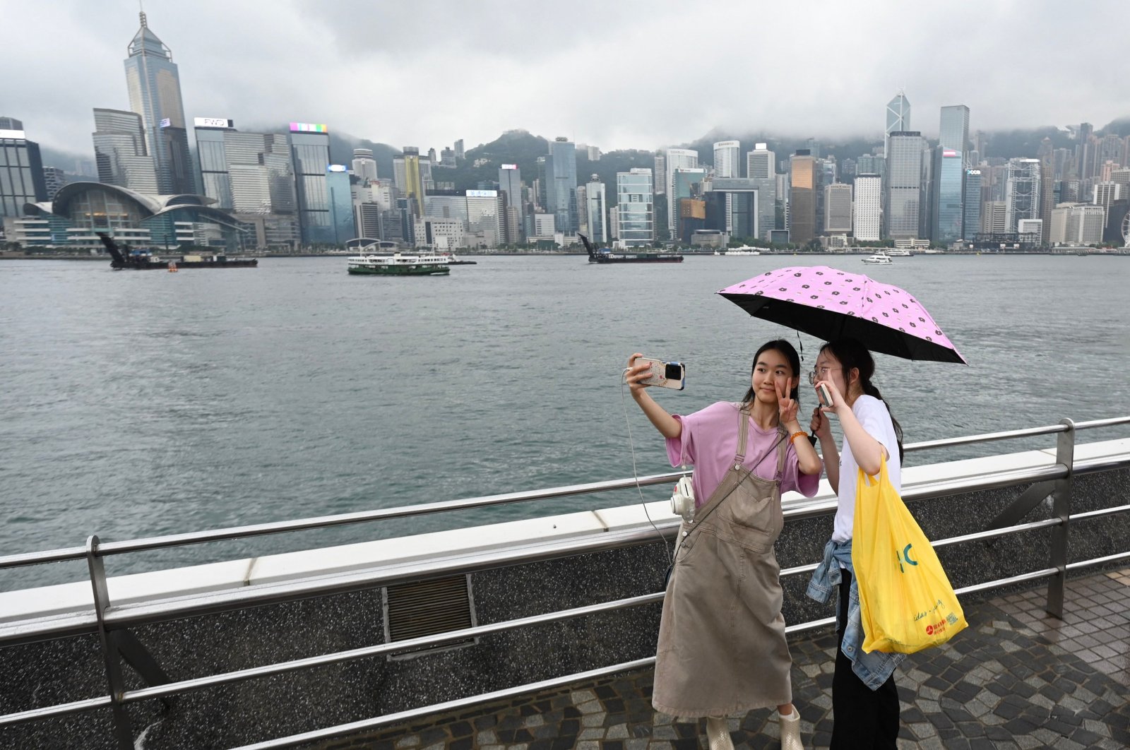 Tourists from mainland China visit the Tsim Sha Tsui waterfront in Hong Kong at the start of the Golden Week holiday period, China, May 1, 2024. (AFP Photo)