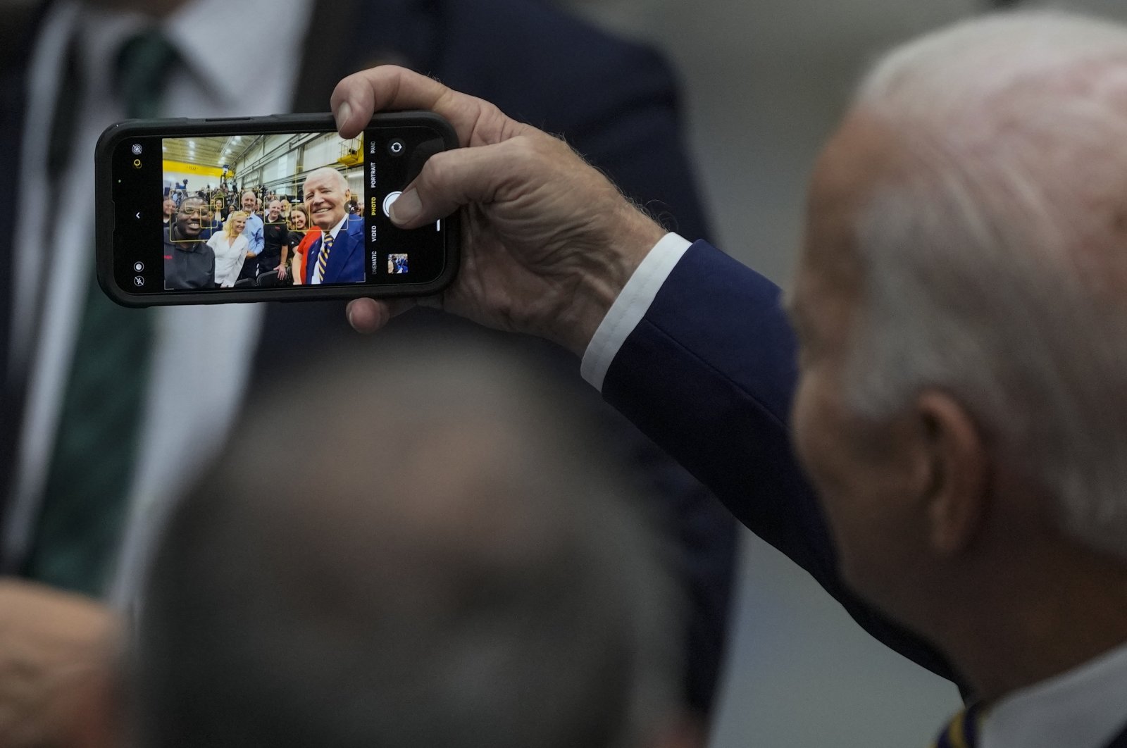 U.S. President Joe Biden takes a selfie after speaking at Ingeteam Inc., Milwaukee, U.S., Aug. 15, 2023. (AP Photo)